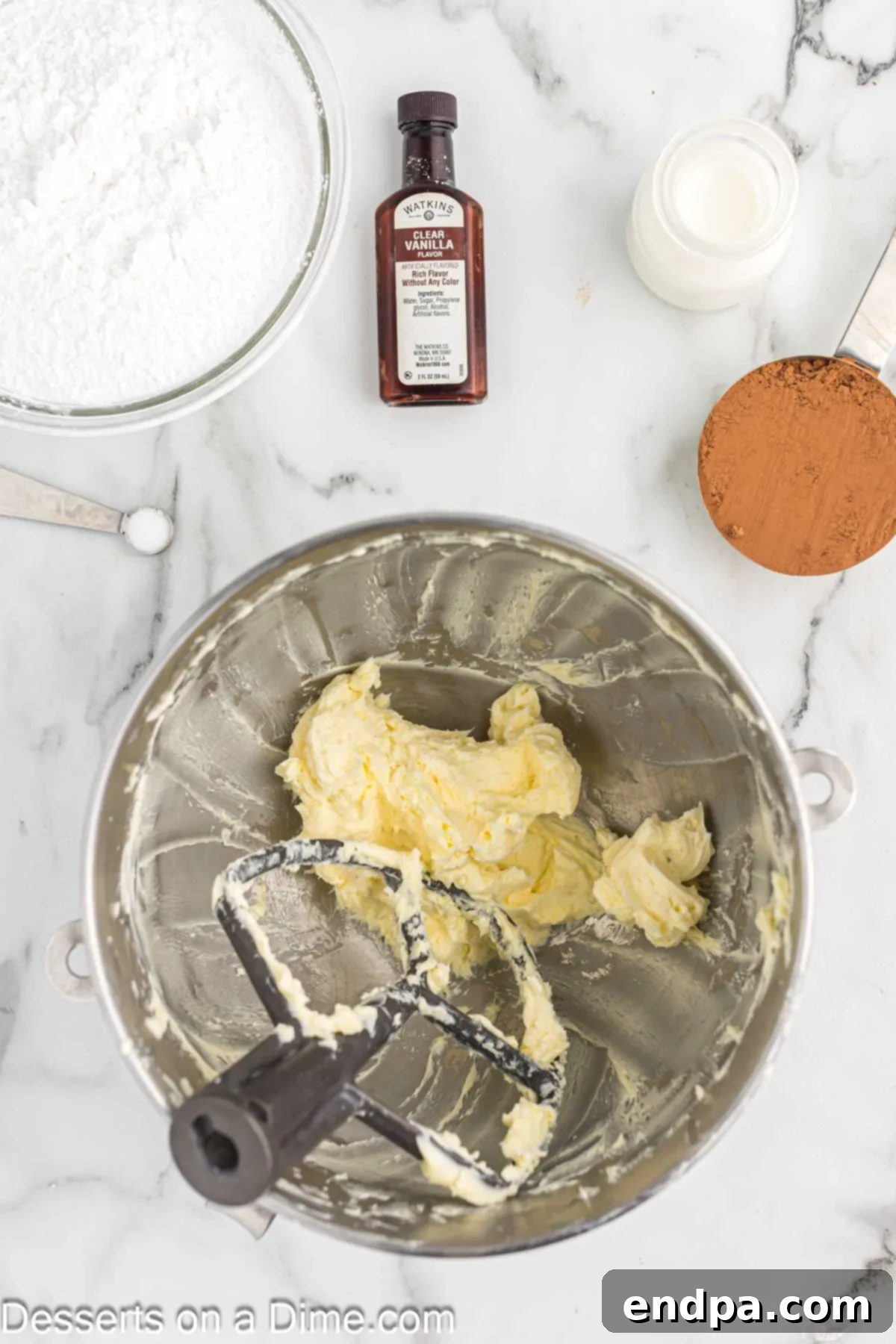 Butter in bowl being creamed. 