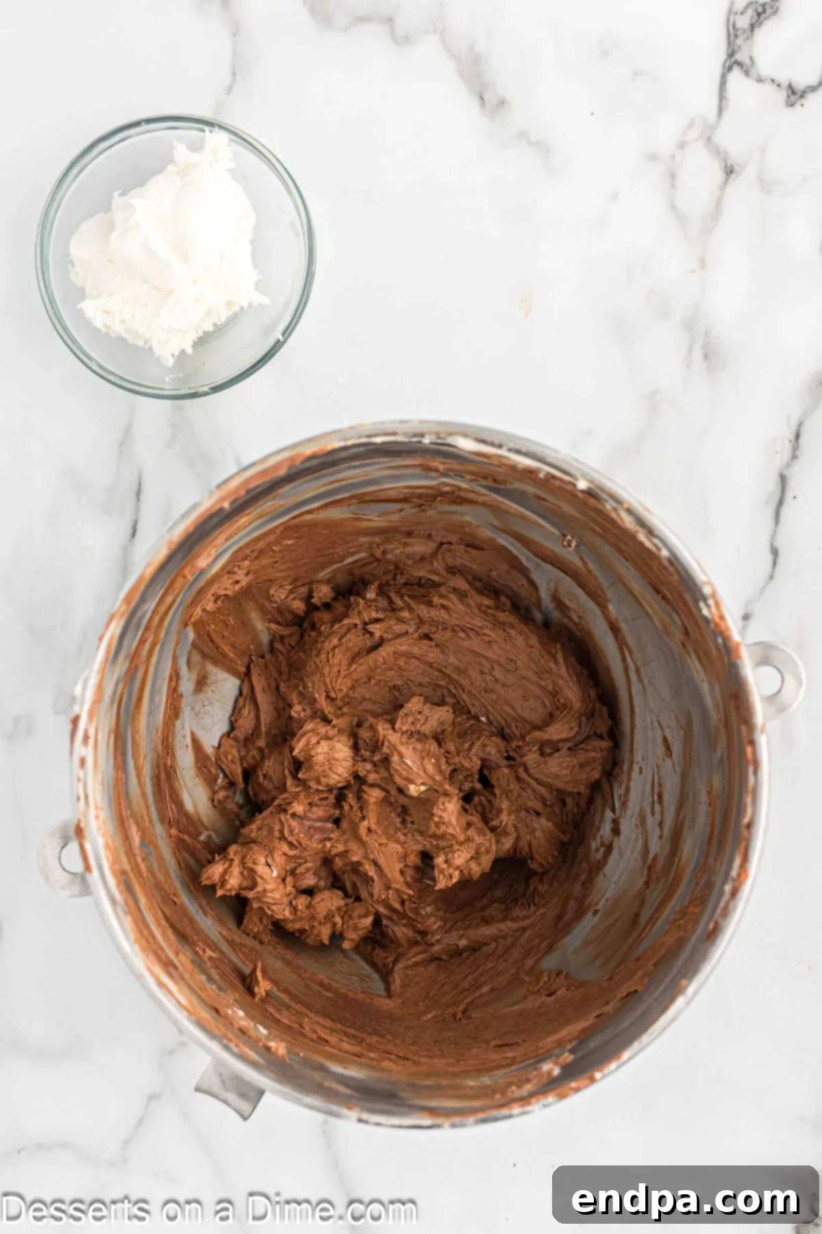 Cocoa powder added to bowl. 