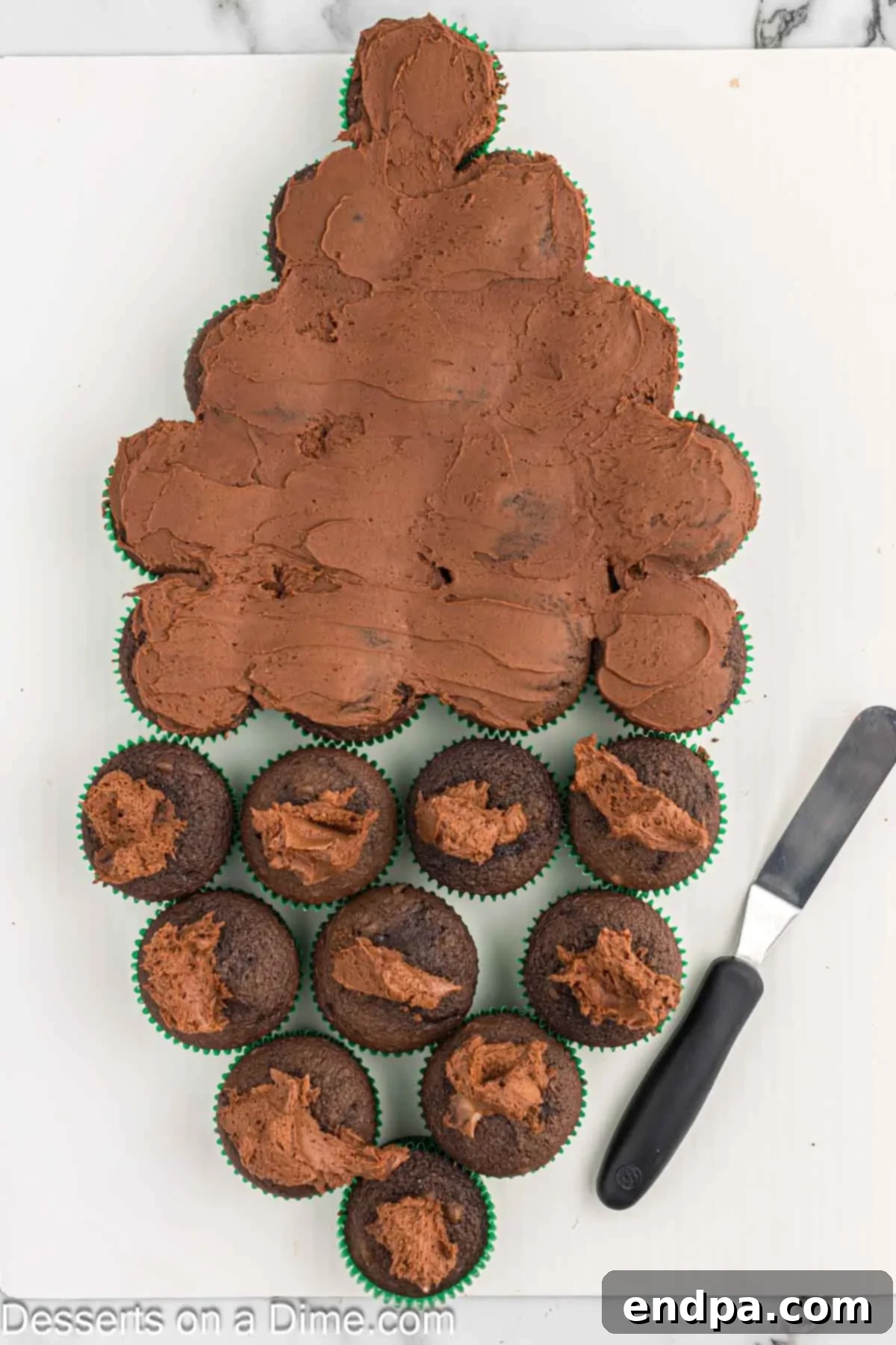 Frosting spread on cupcakes. 