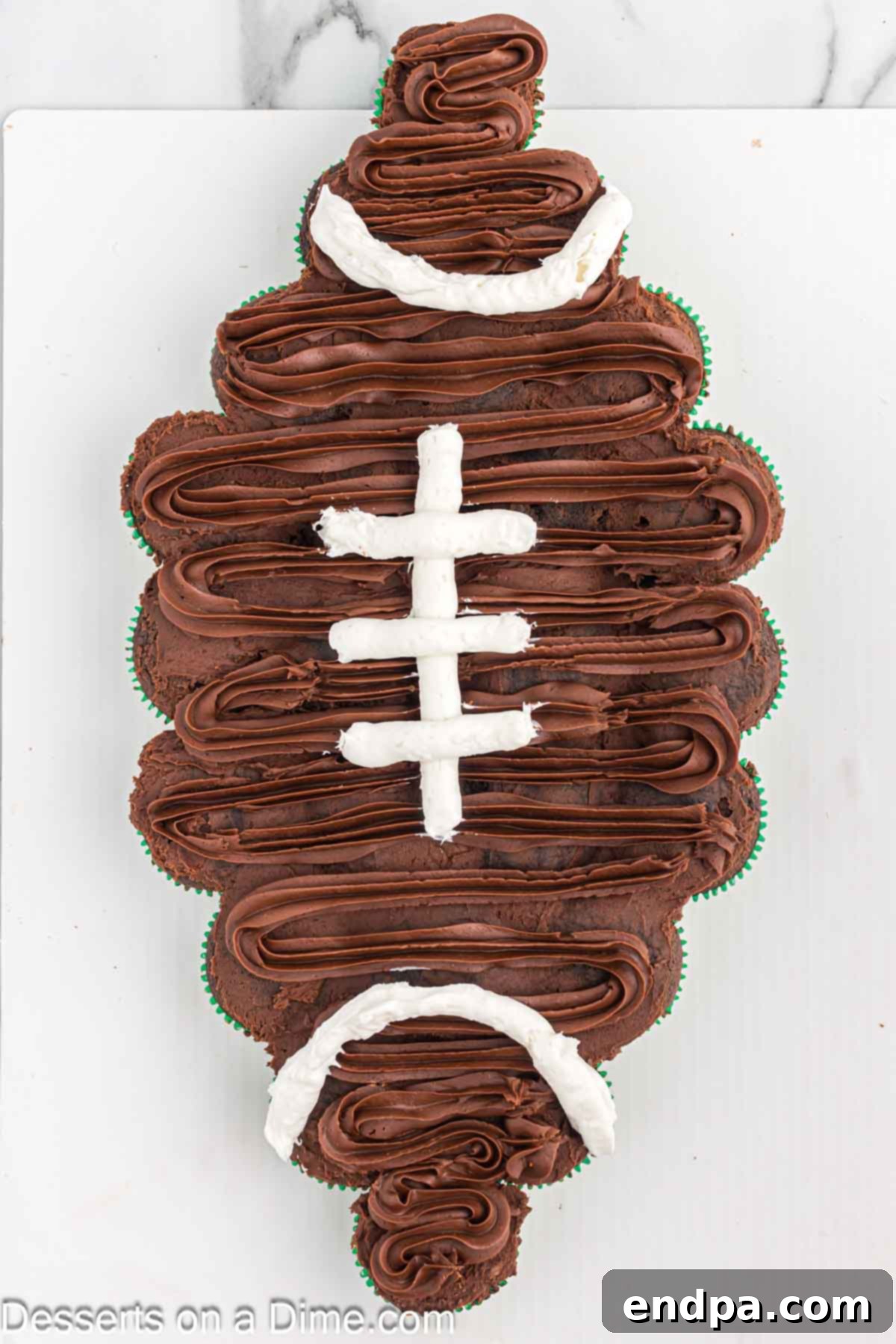 White icing piped on the cake. 