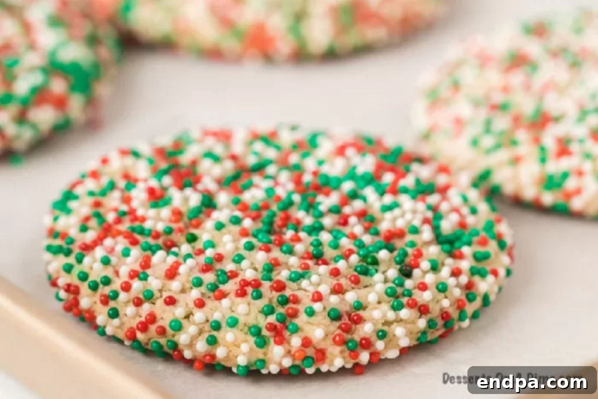 Quick and Festive Cake Mix Christmas Cookies 2 Close-up image of a stack of festive Christmas sprinkle cookies, showcasing their vibrant red and green colors and soft texture.
