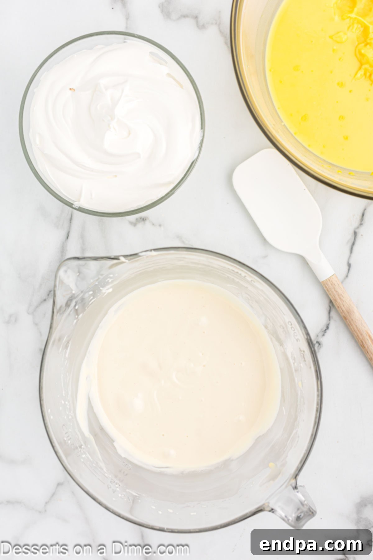 Paula Deen's Southern Banana Pudding 7 Separate bowl with cream cheese and milk.