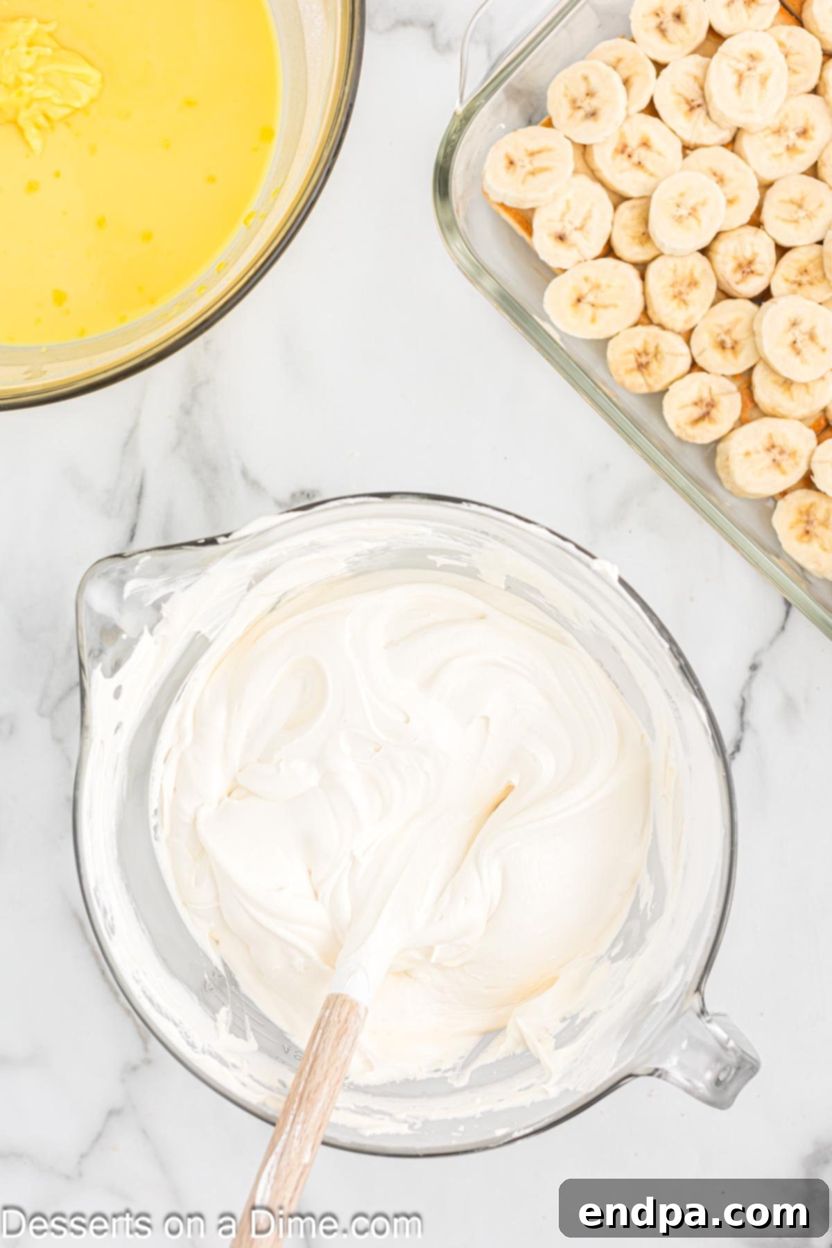 Paula Deen's Southern Banana Pudding 8 Whipped cream folded into bowl.