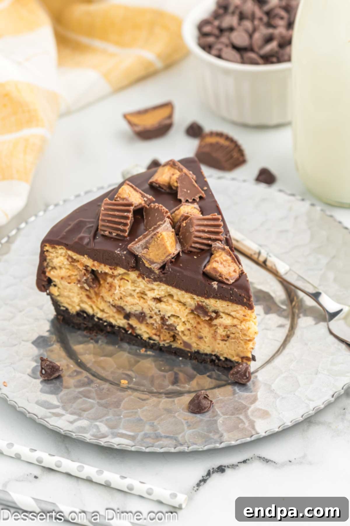 Slice of Reese's Cheesecake on plate. 