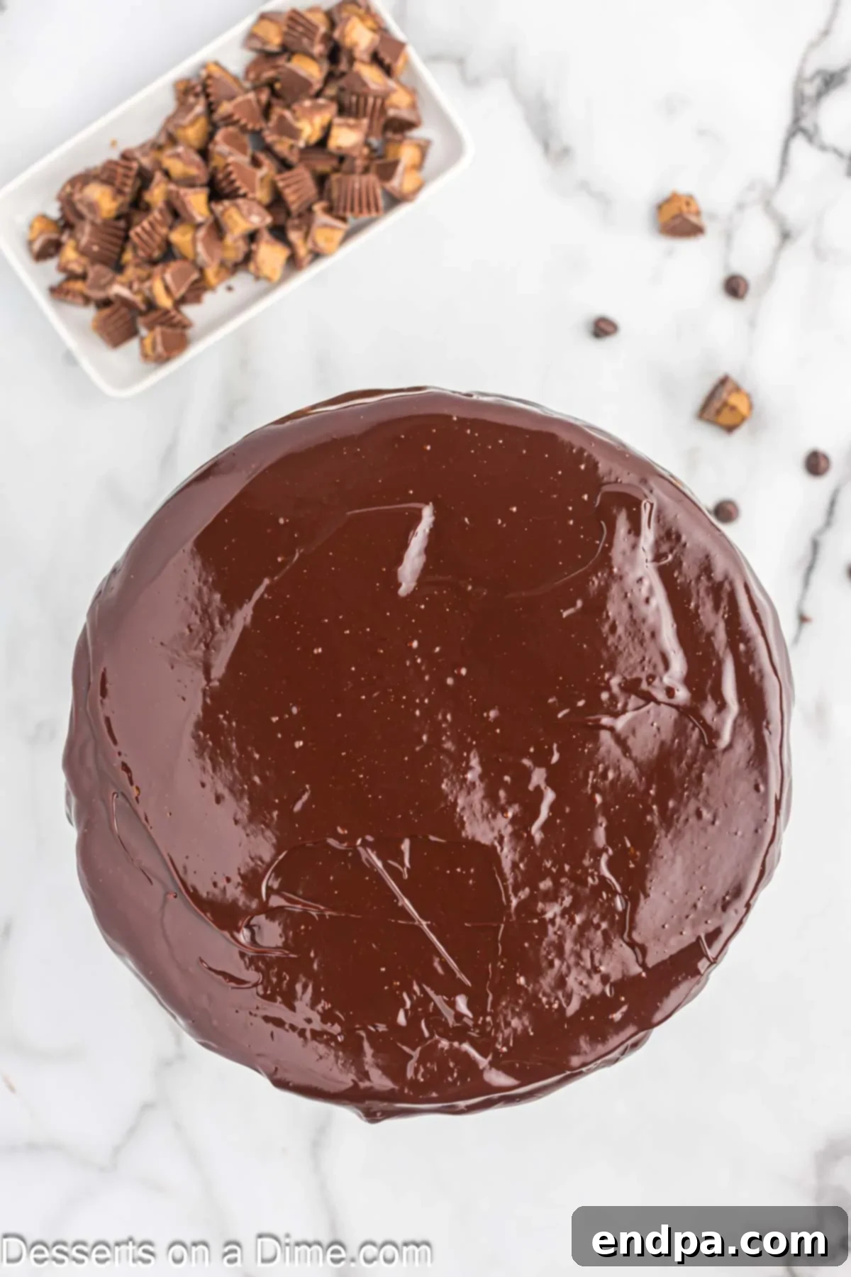 Ganache poured over cheesecake. 