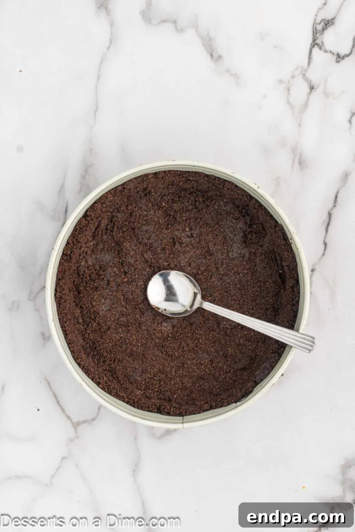 Cookie crumbs and melted butter combined and pushed into pan. 