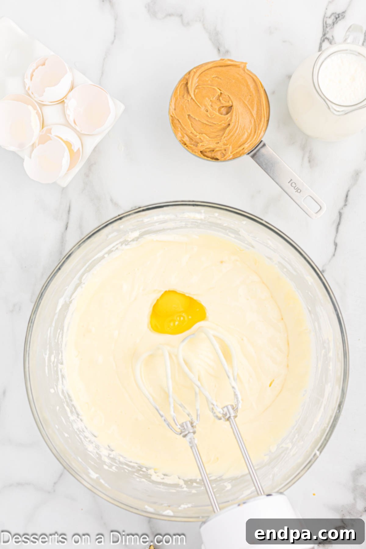 Eggs added to mixture one at a time. 