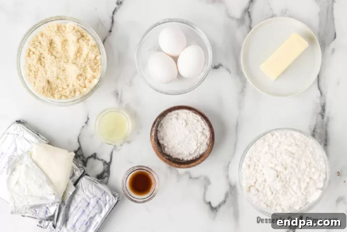 Ingredients for keto cheesecake including almond flour, butter, erythritol powdered sugar, vanilla, cream cheese, eggs, and lemon juice.