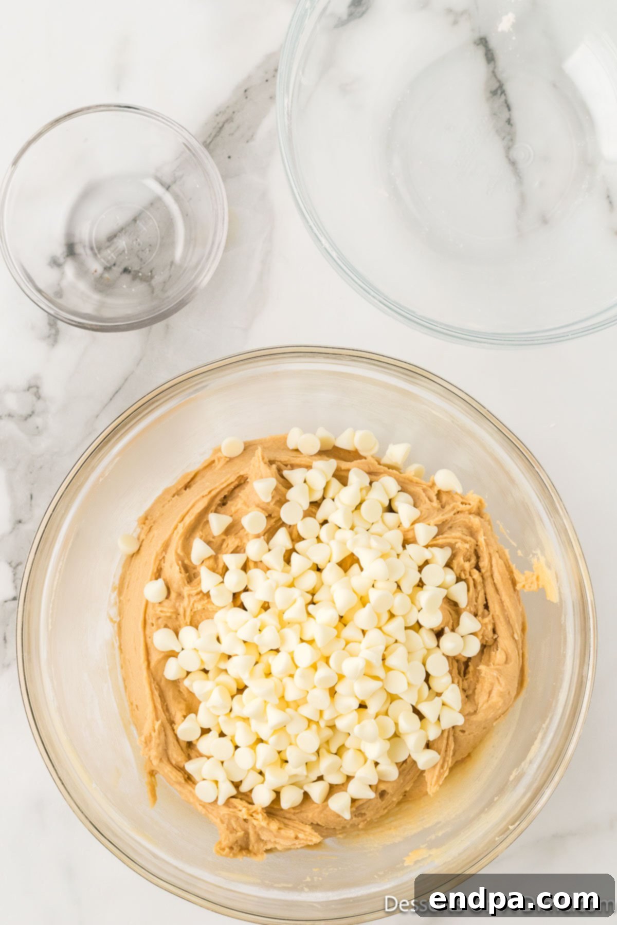 White chocolate chips folded into mixture. 