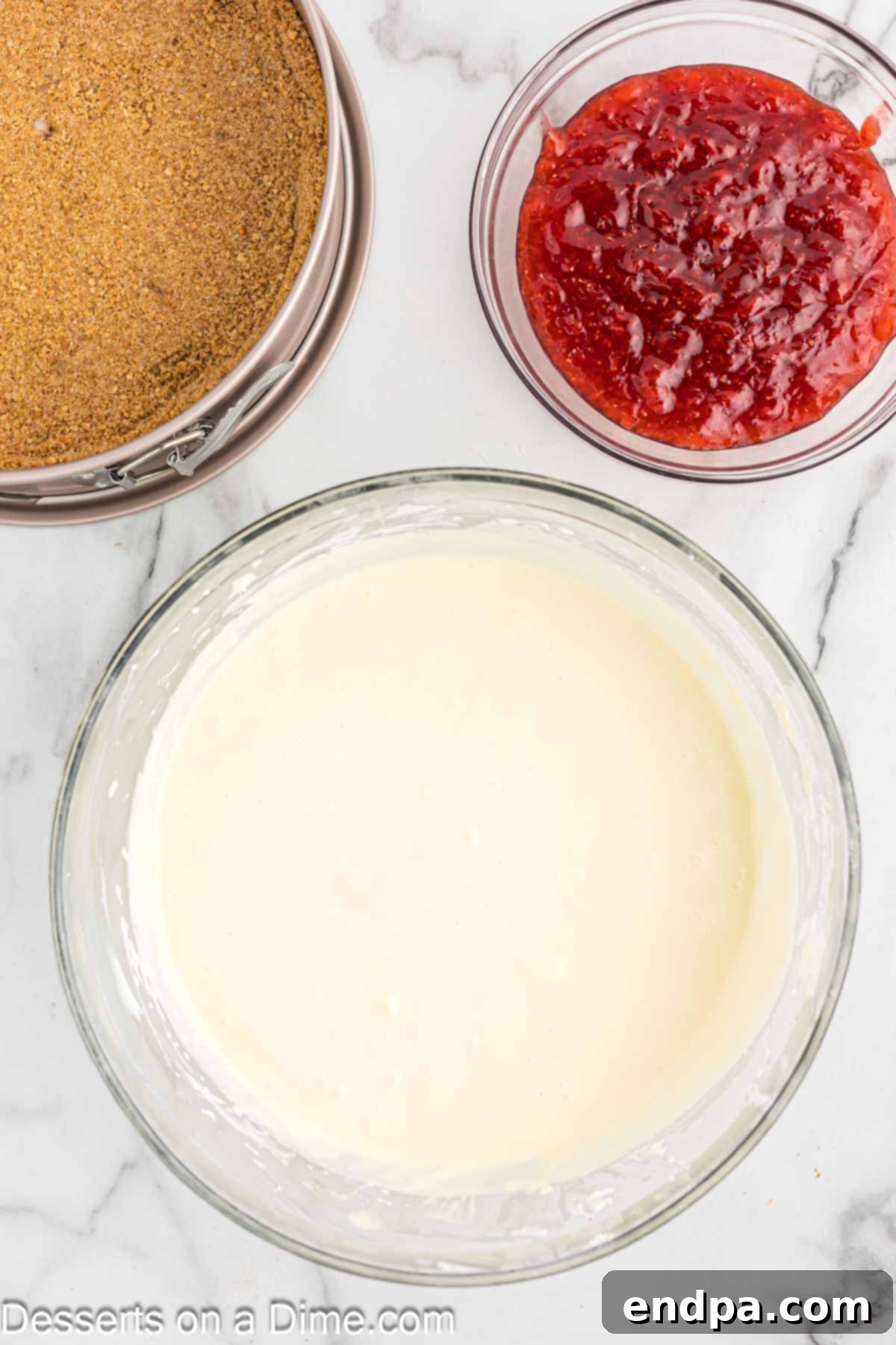 All cheesecake filling ingredients combined in a bowl, ready for pouring.
