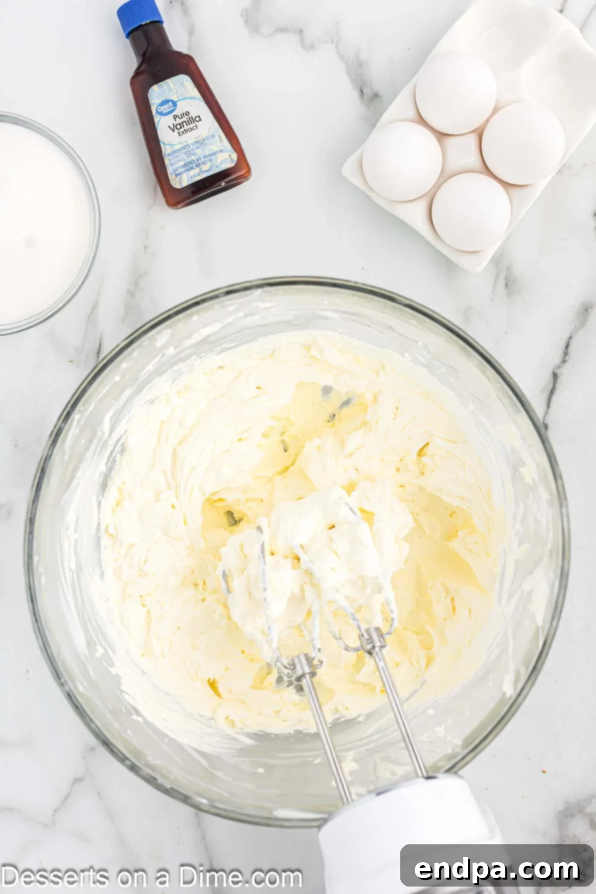 Cream cheese filling in a mixing bowl, smooth and creamy.
