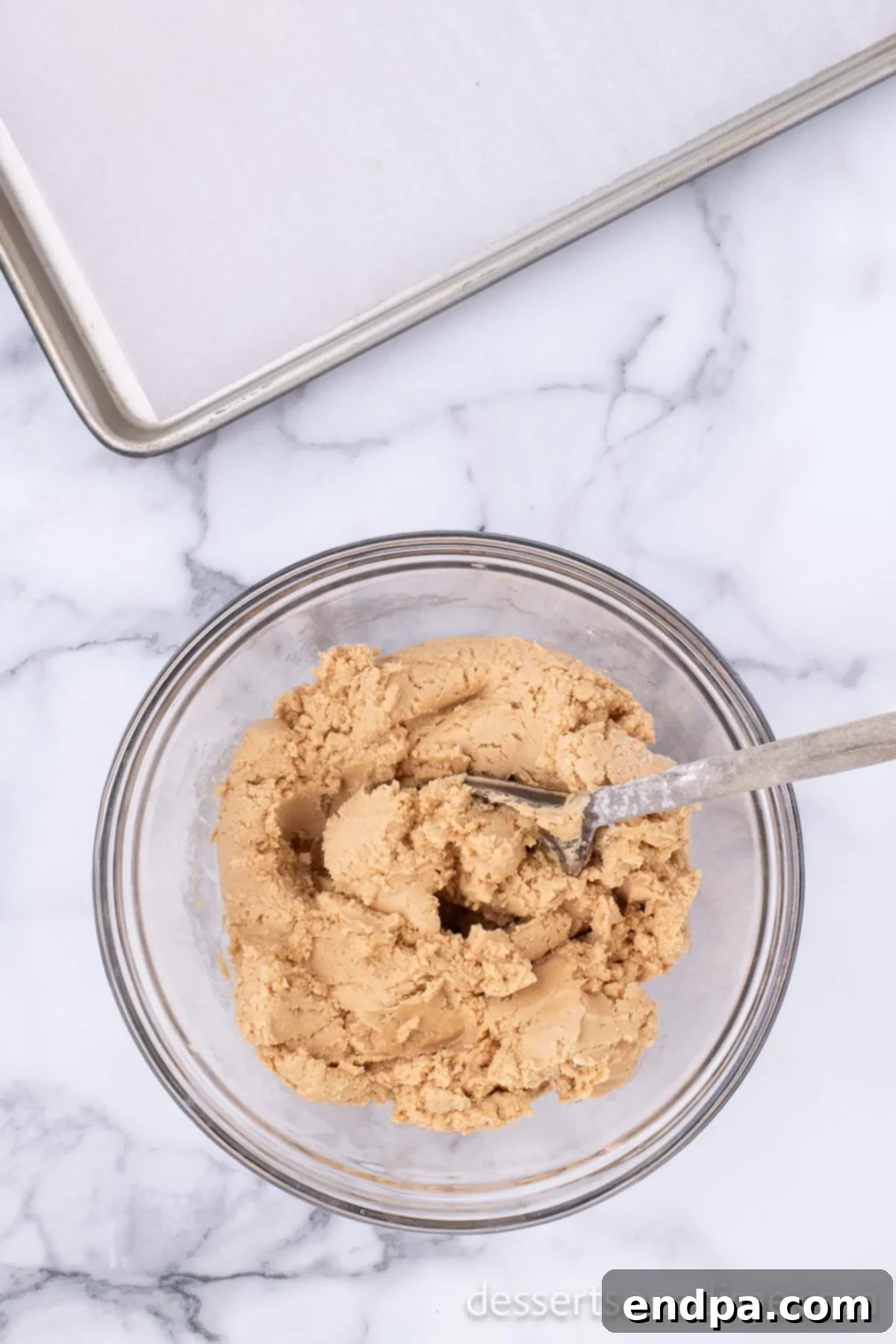 Decadent Chocolate Peanut Butter Bites 5 The fully combined peanut butter mixture in a bowl, now firm and ready to be shaped into balls.