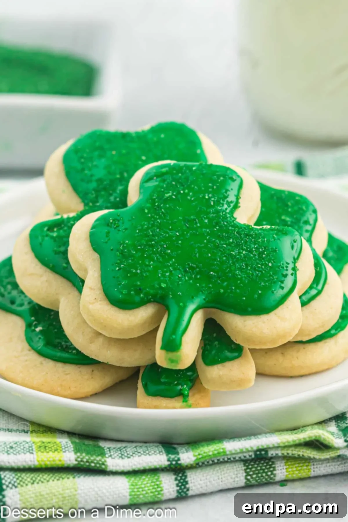 Emerald Clover Delights 16 A charming close-up of a plate filled with freshly baked and decorated shamrock cookies, showcasing their vibrant green frosting and festive sprinkles, perfect for St. Patrick's Day.