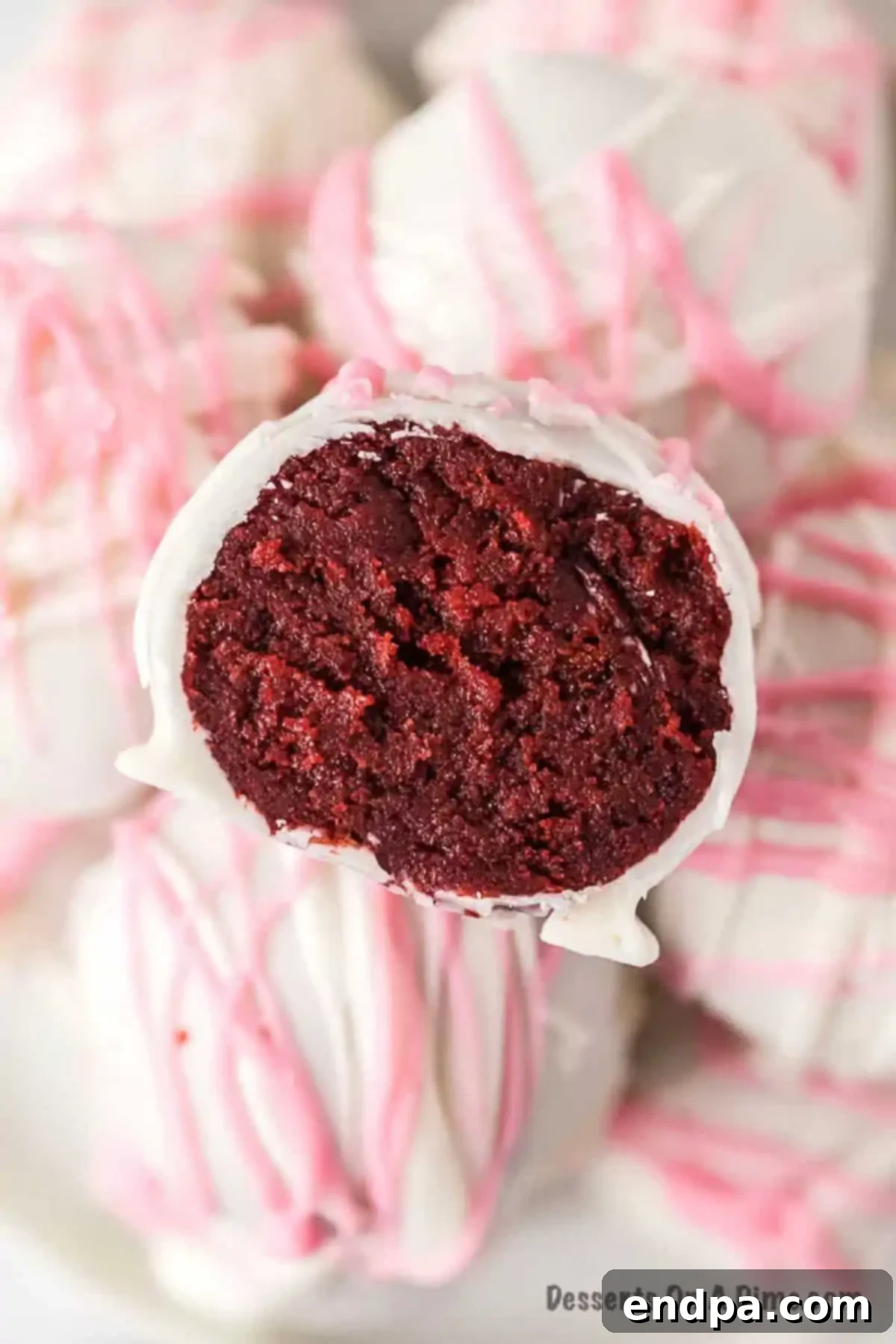 Red Velvet Cake Balls decorated and stacked on a platter, ready to be served.