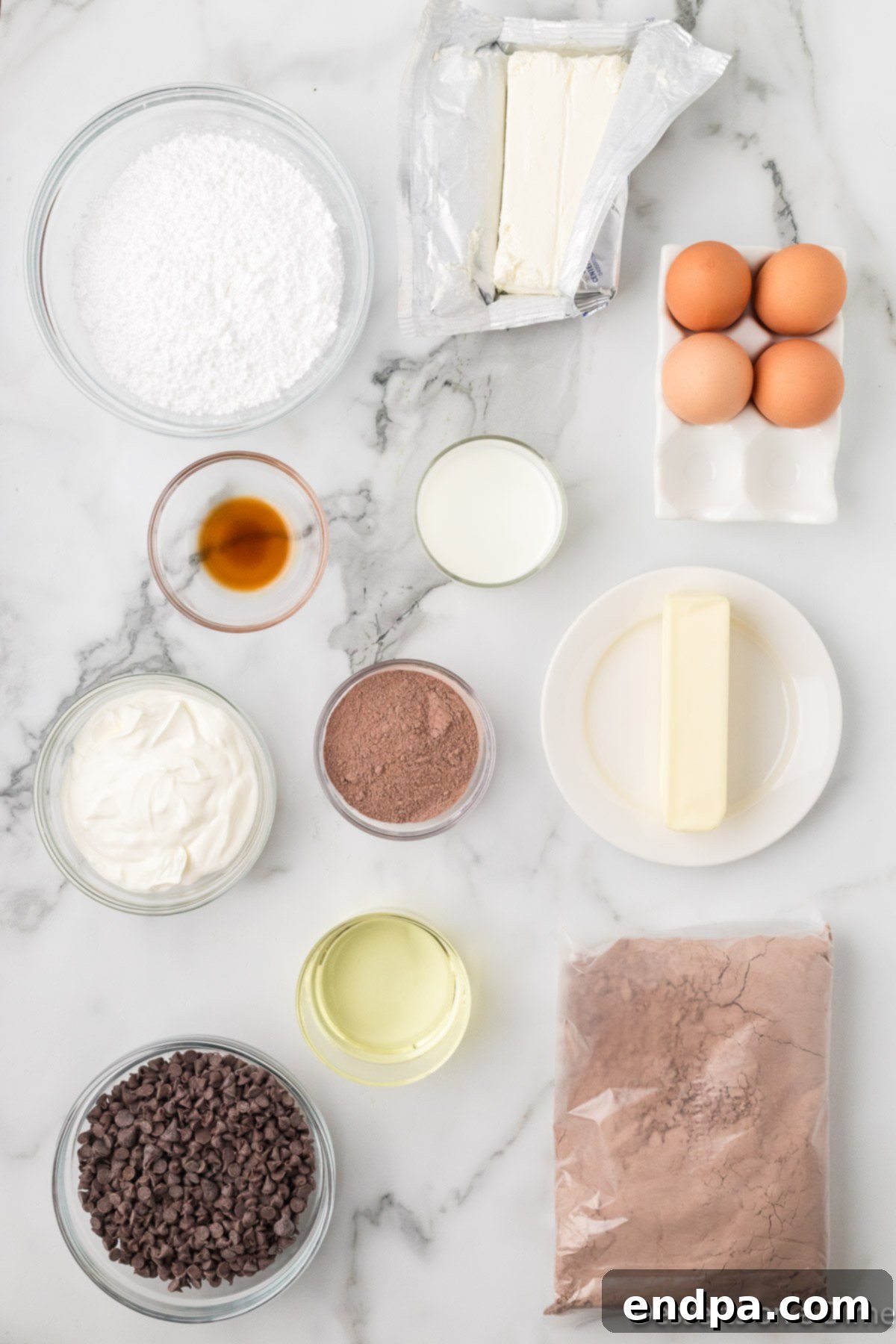 Ingredients for recipe - cake mix, pudding, sour cream, eggs, milk, oil, chocolate chips, cream cheese, butter, powdered sugar, vanilla. 