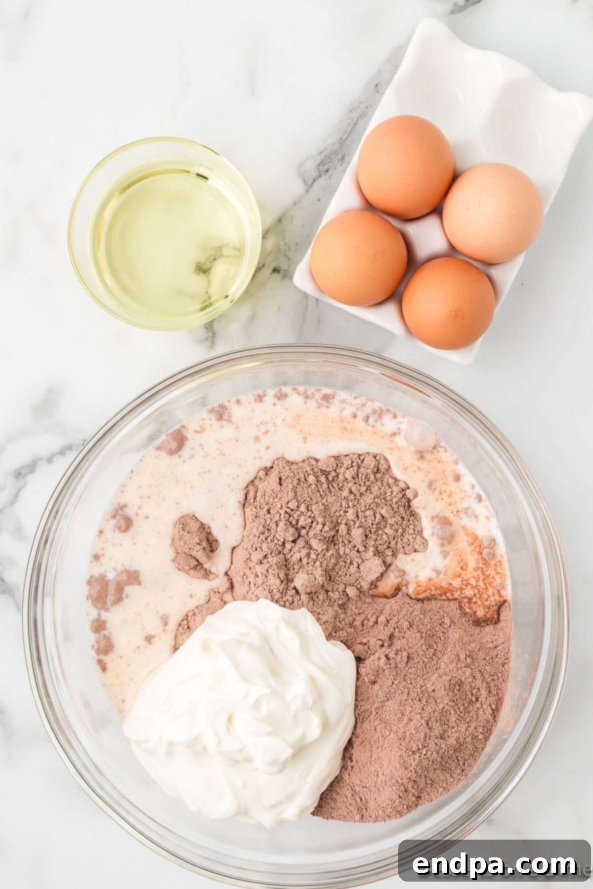 Bowl with wet and dry ingredients combined in bowl. 