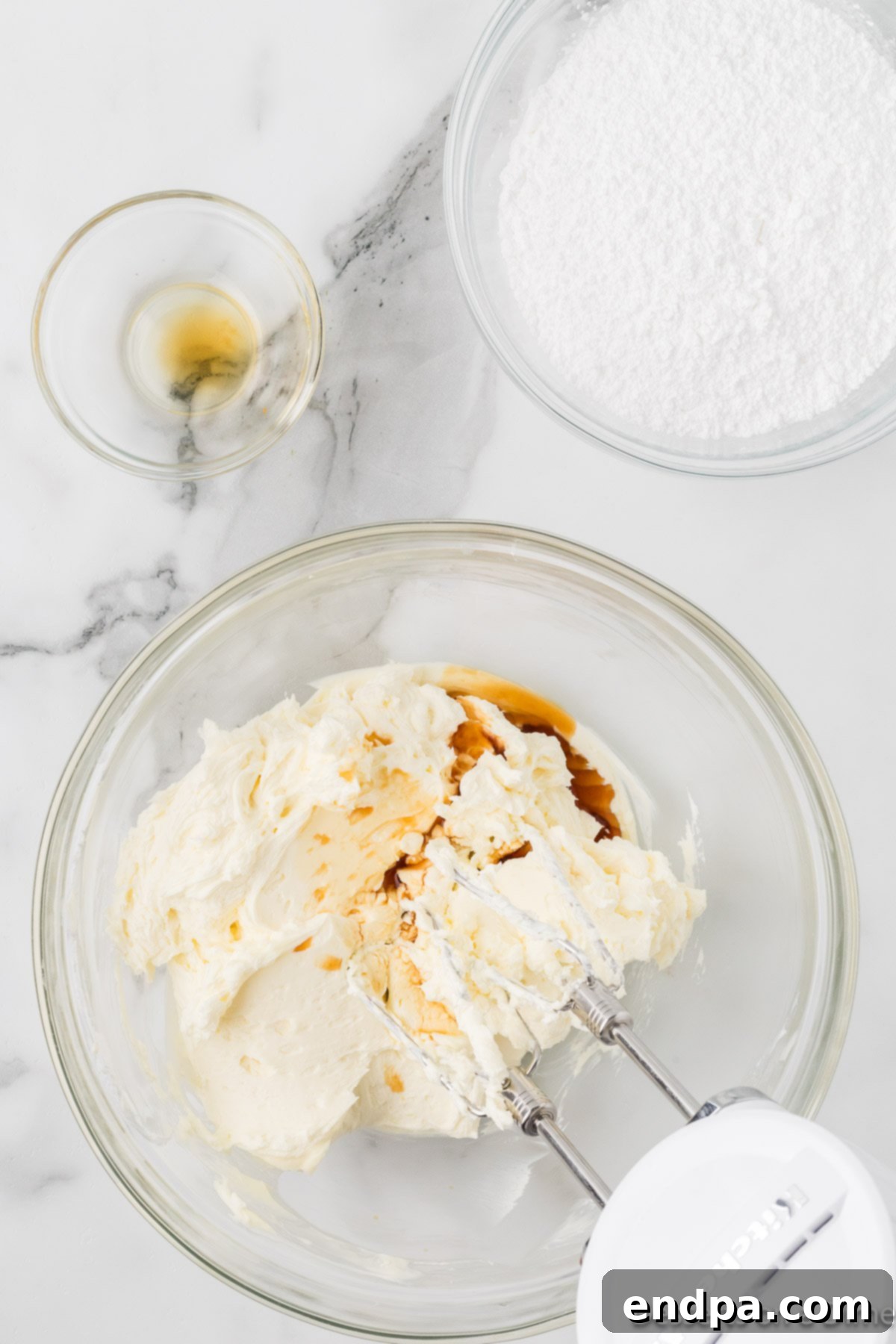 Vanilla added and combined to frosting mixture. 