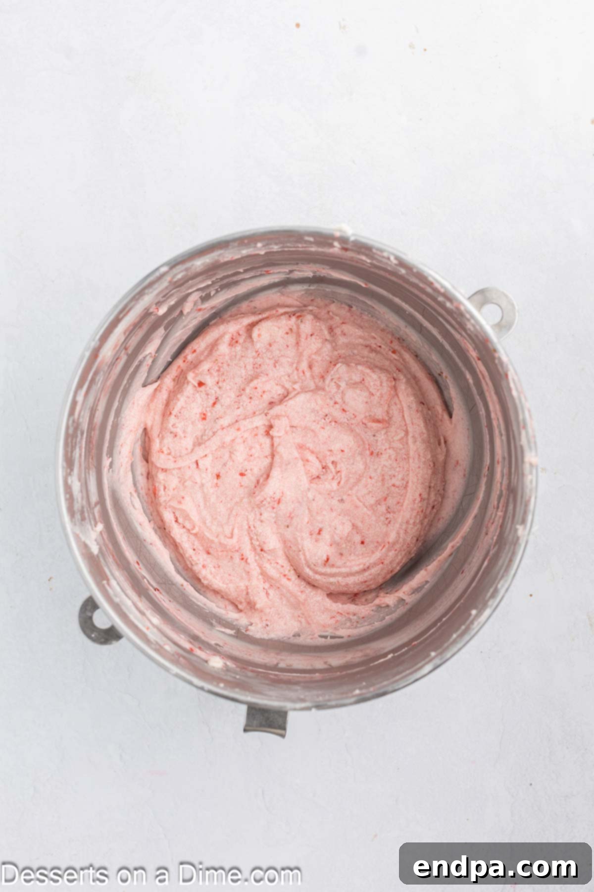 Sweetheart Swirl Cupcakes 7 Powdered sugar added with strawberries to butter.