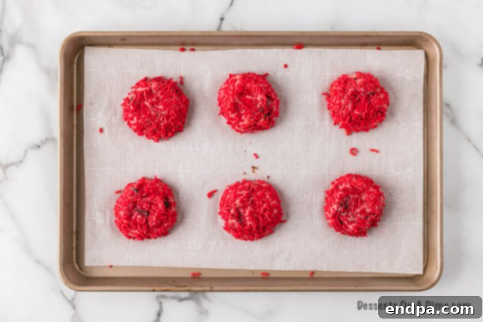 Freshly baked cookies, golden brown around the edges, cooling on the baking sheet.