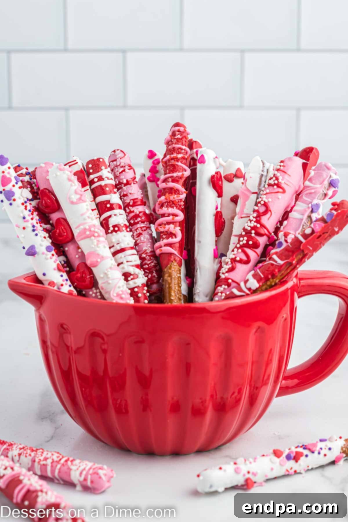 Valentine's Day Pretzel Rods presented beautifully in a festive red bowl, ready for serving or gifting.