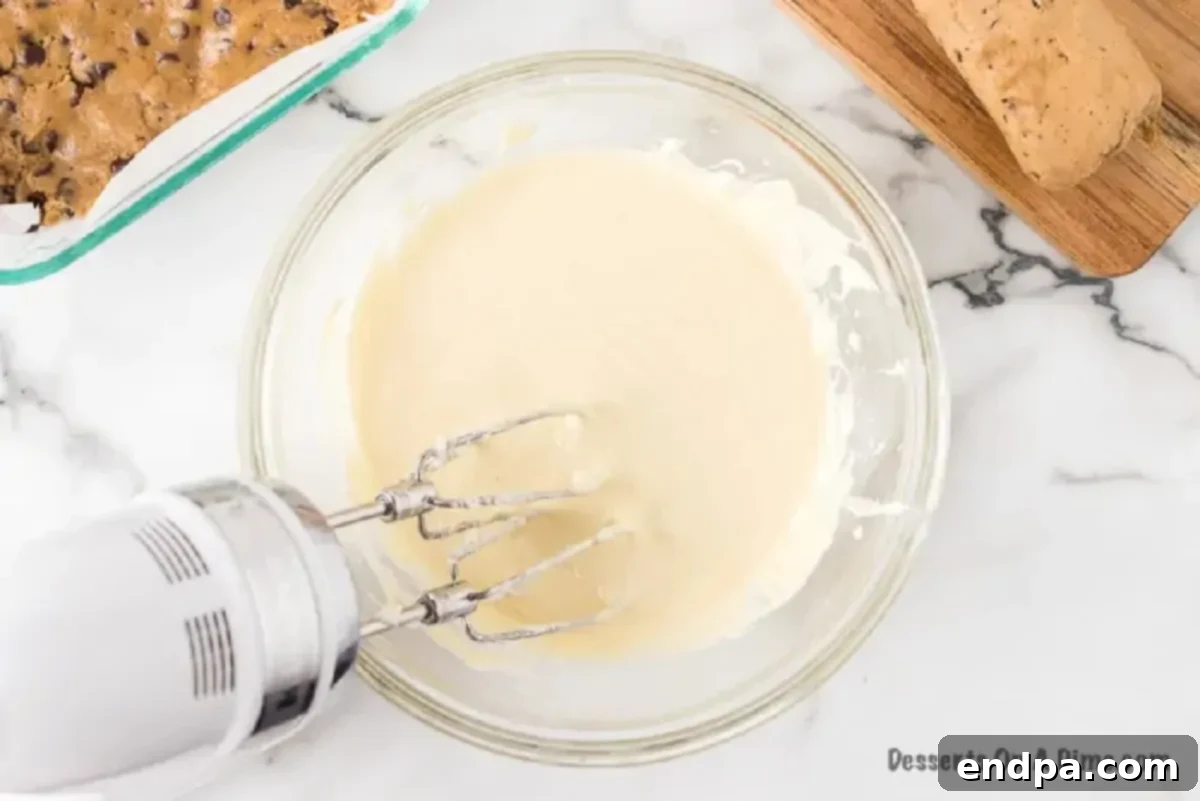 Cream cheese mixture in a mixing bowl, beaten until light and fluffy.