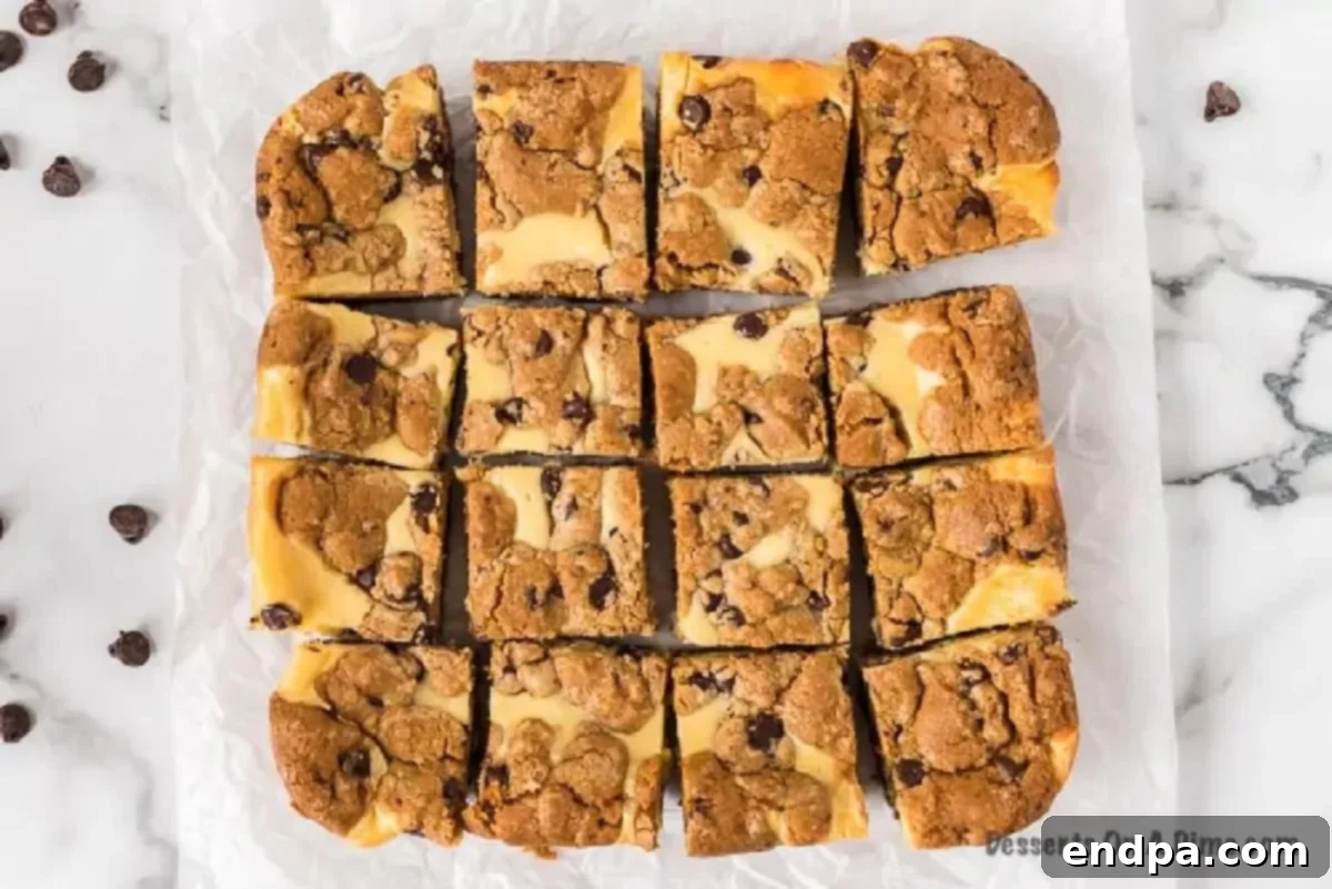 Chocolate chip cheesecake bars cut into neat squares after chilling, ready for serving.