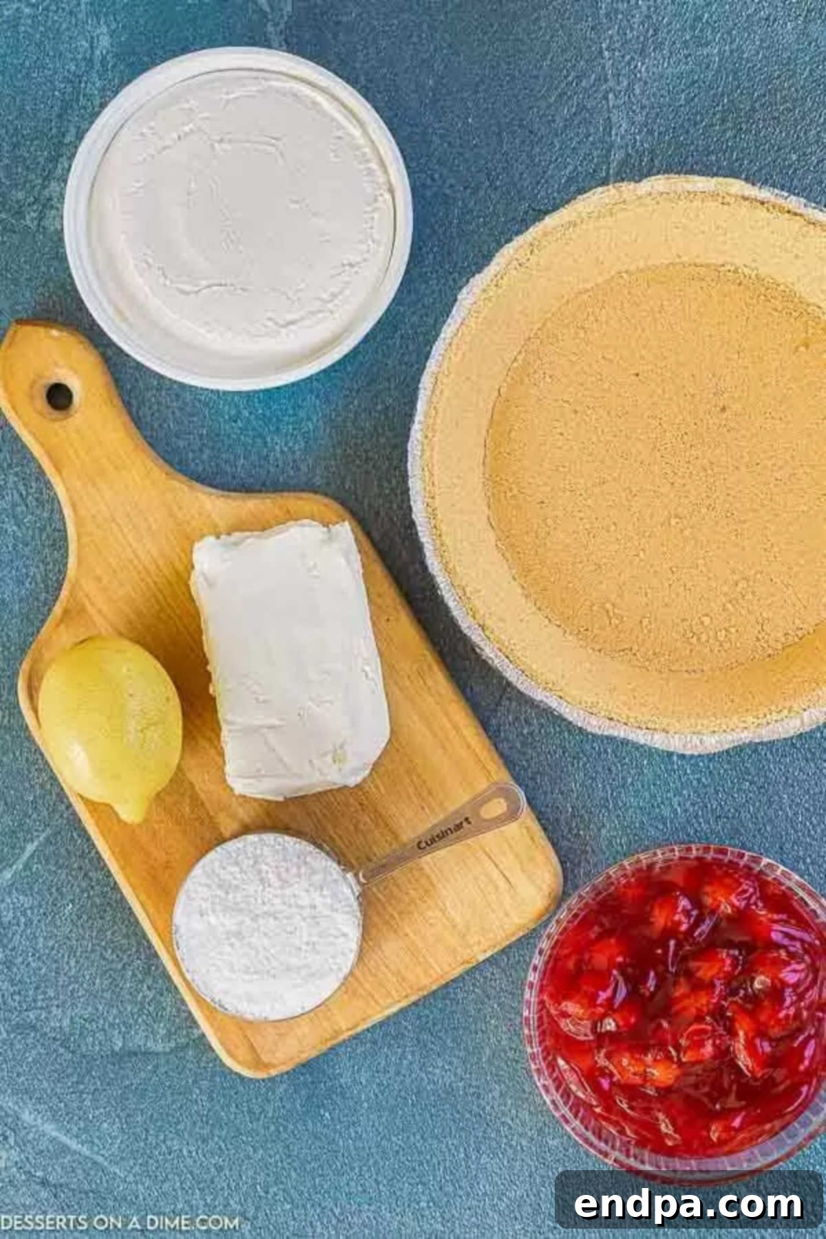 Ingredients for No Bake Cherry Cheesecake: cream cheese, lemon juice, powdered sugar, cool whip, graham cracker crust, and cherry pie filling.