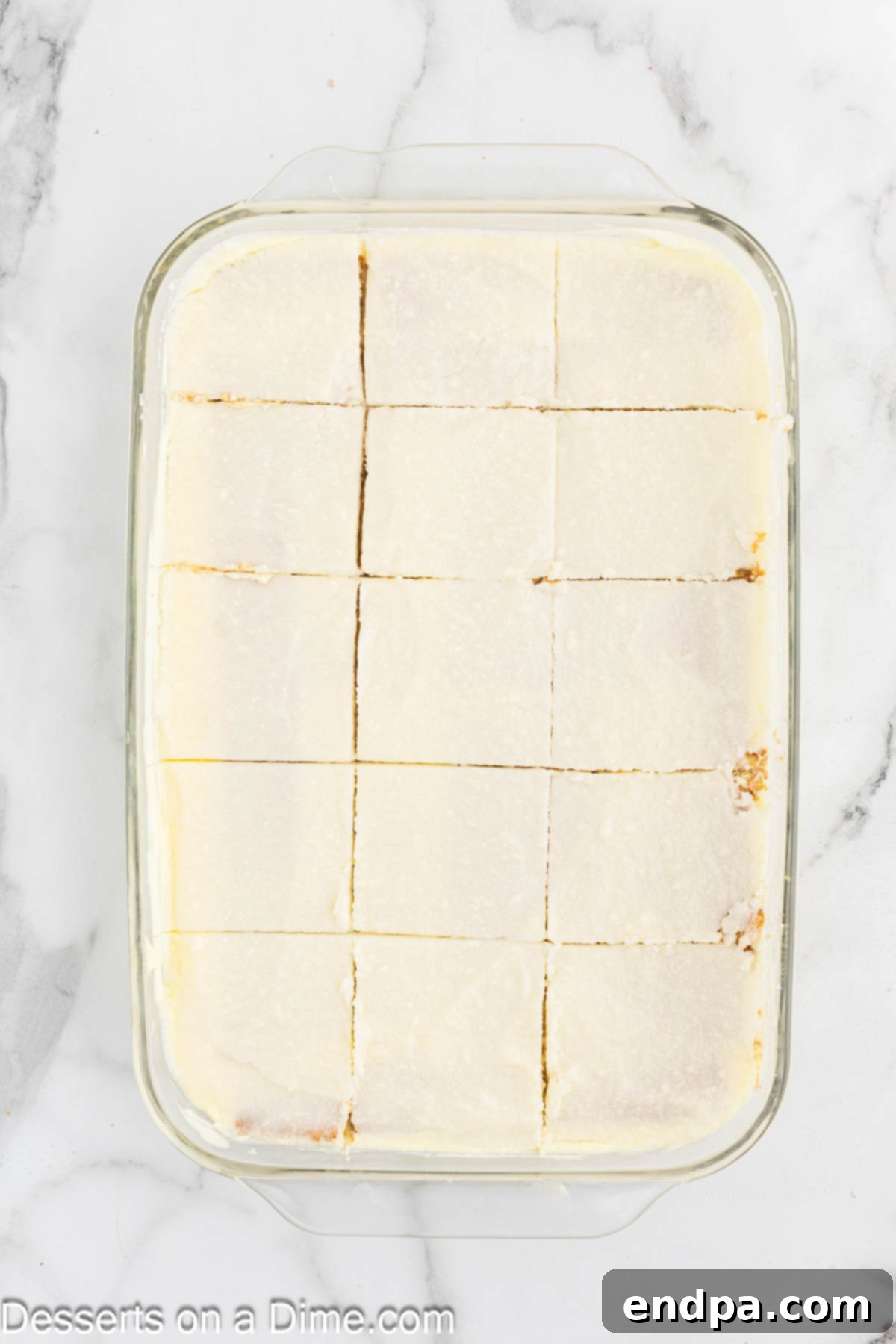 A perfectly set Lemon Icebox Cake, ready to be sliced and served, showcasing its tempting layers.