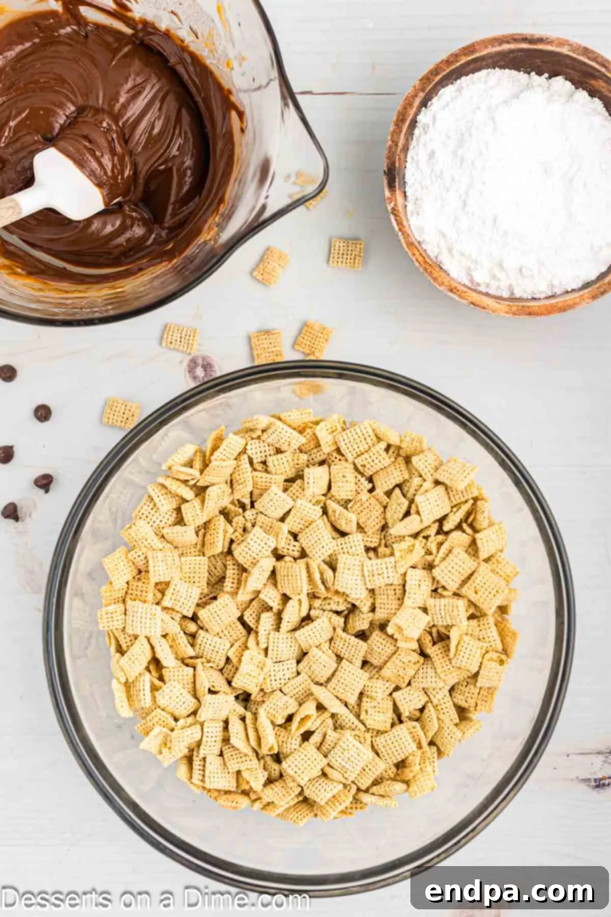 Chex cereal prepared in a large mixing bowl, ready for the chocolate coating.