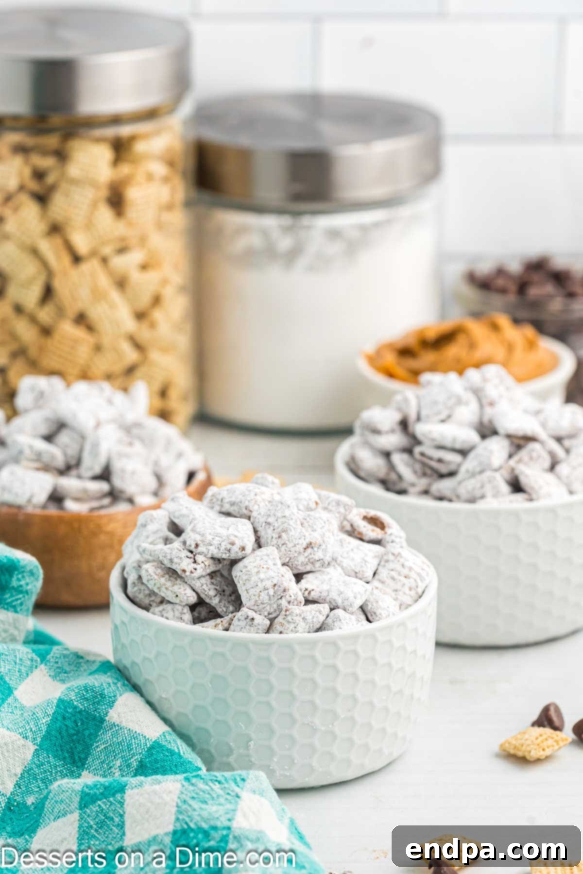 Individual servings of Puppy Chow in small bowls, ready to be enjoyed as a snack or dessert.