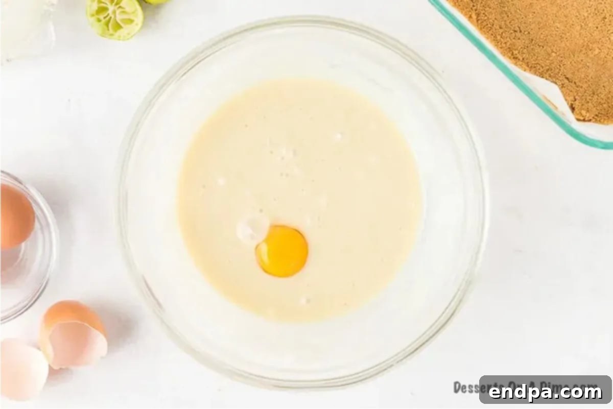 Zesty Key Lime Squares 6 Eggs added to bowl.