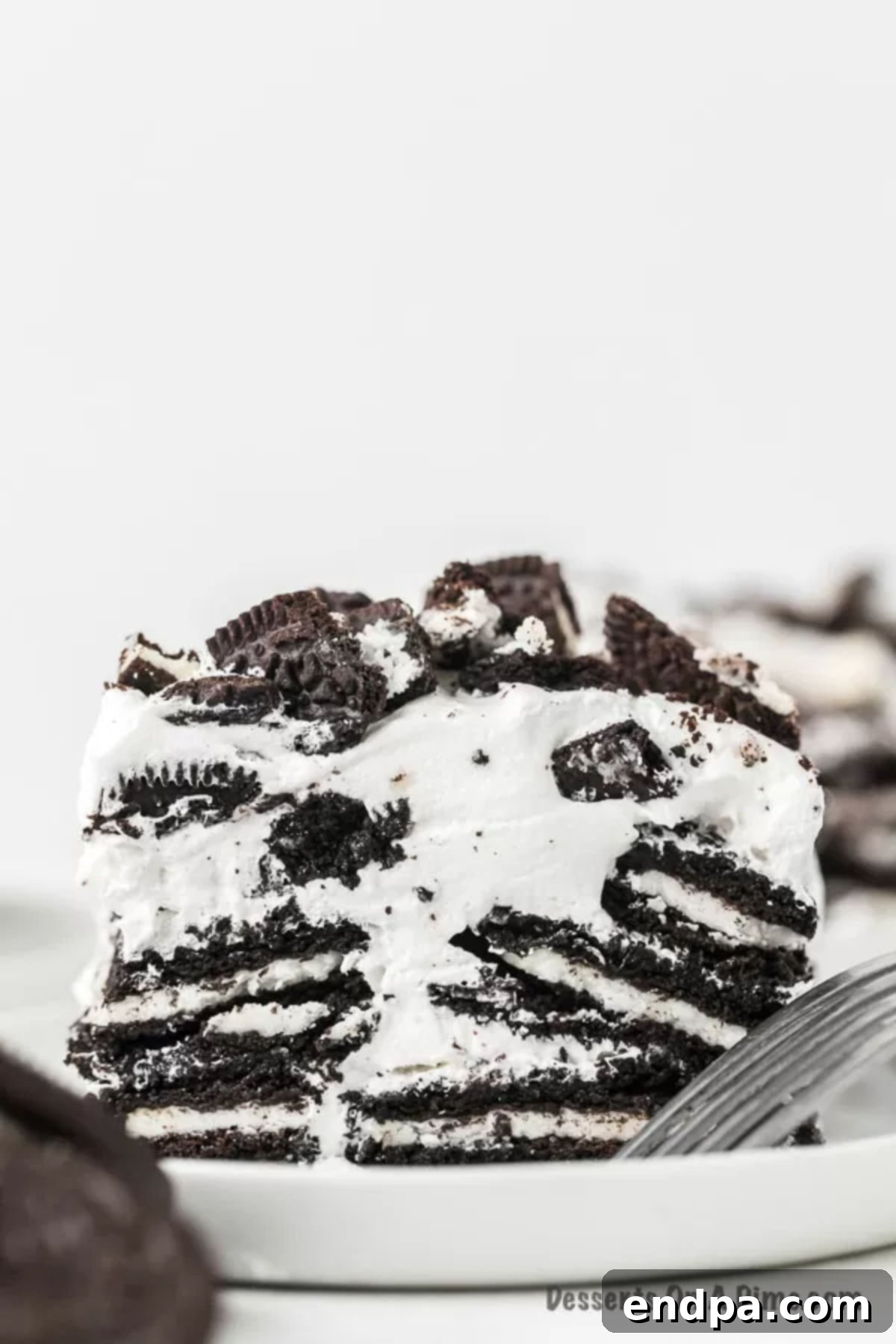 Slice of Oreo No Bake Cake on a plate.