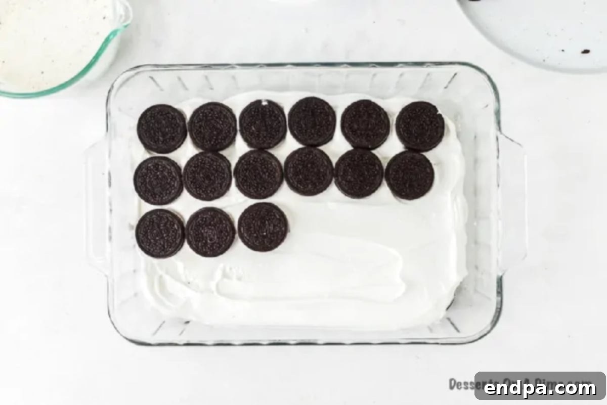 Another layer of cookies on whipped cream.