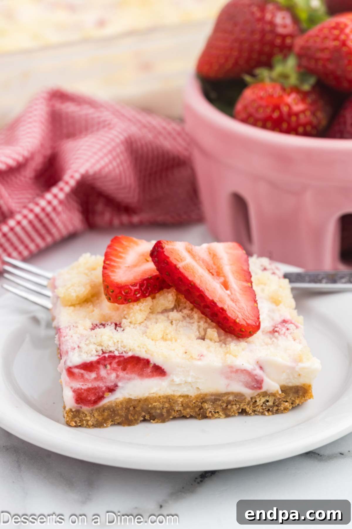 Strawberry Bars sliced and ready to serve on a plate.