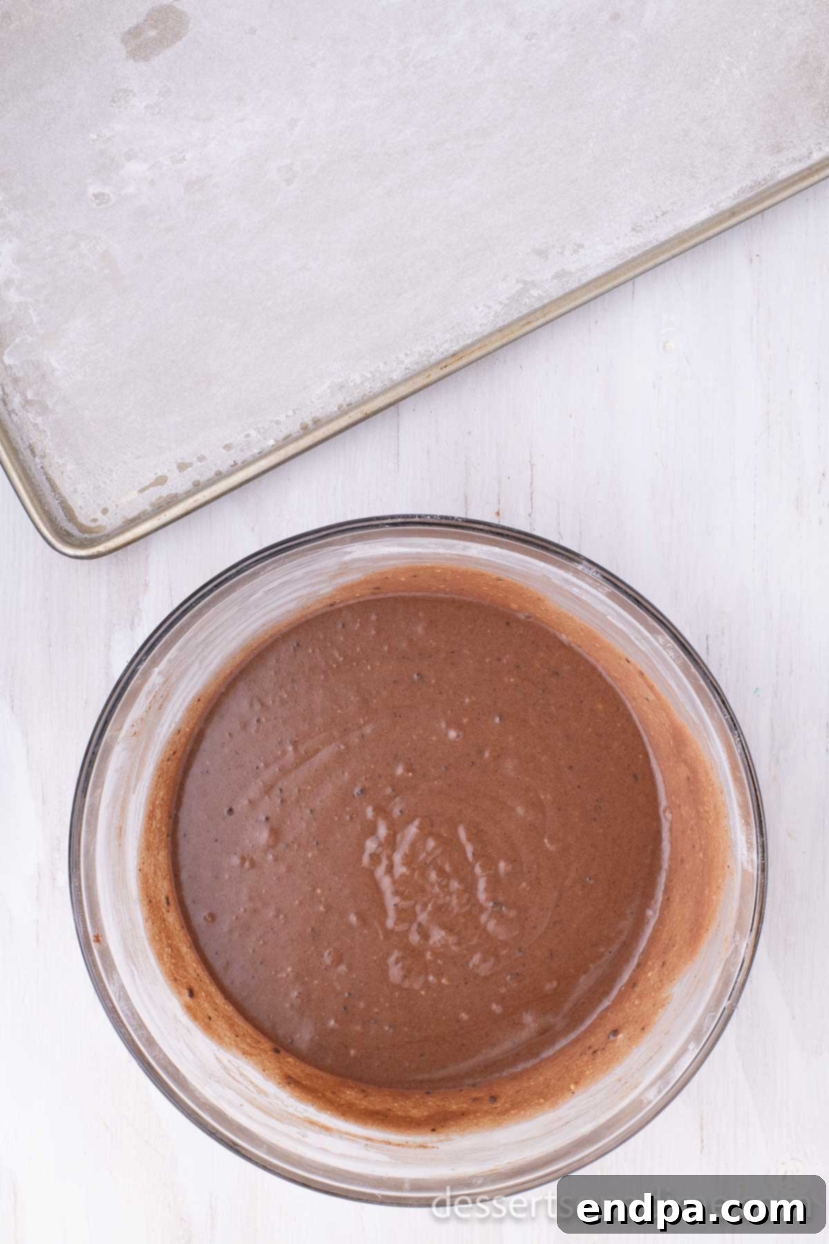Classic Texas Chocolate Sheet Cake 4 A bowl containing the cooled cocoa powder mixture, ready to be added to the main batter.