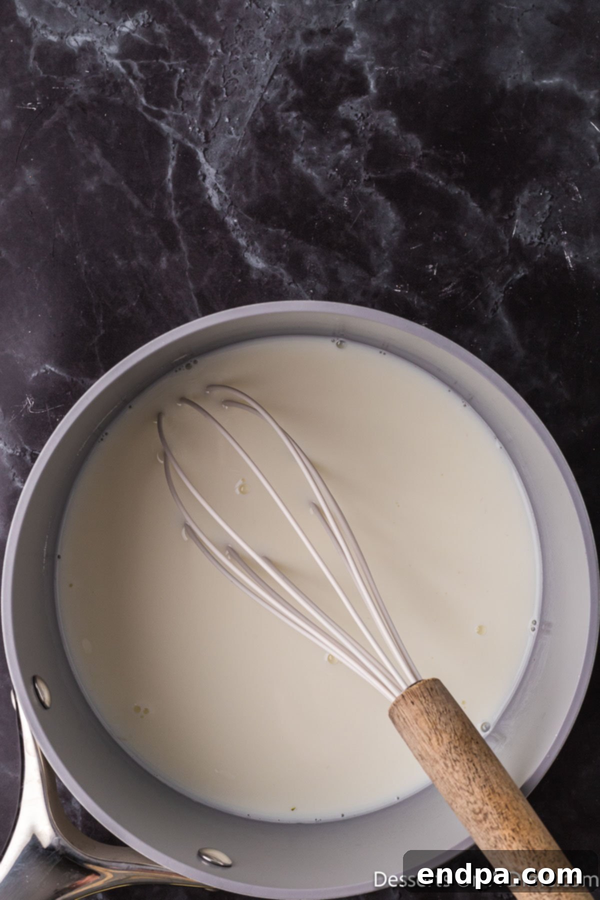 Sweetened Condensed Milk from Scratch 4 Saucepan with milk and sugar.