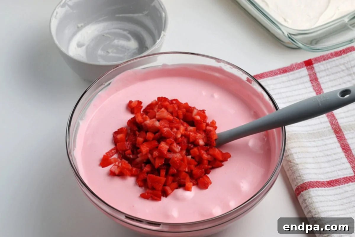 Chopped strawberries added to bowl and combined. 