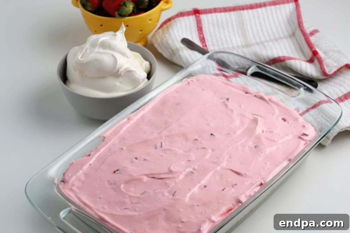 Mixture spread over cheesecake layer. 