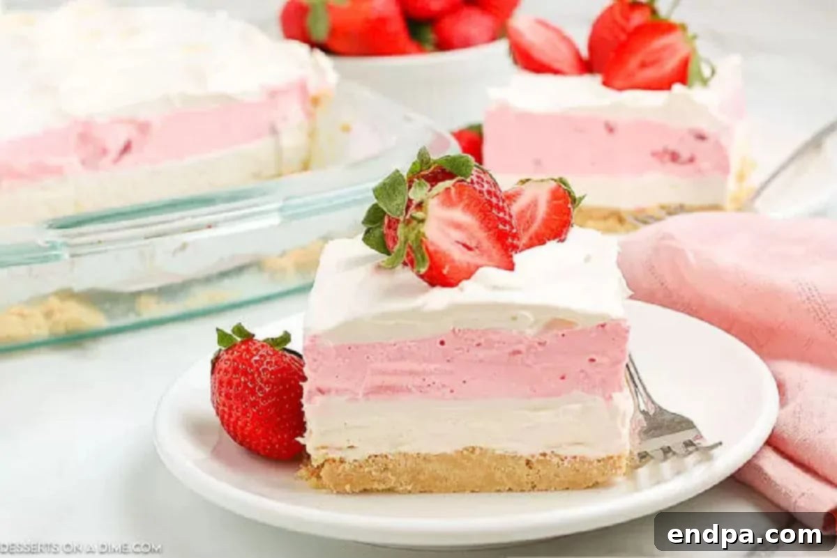 Slice of cake on a plate topped with strawberries. 