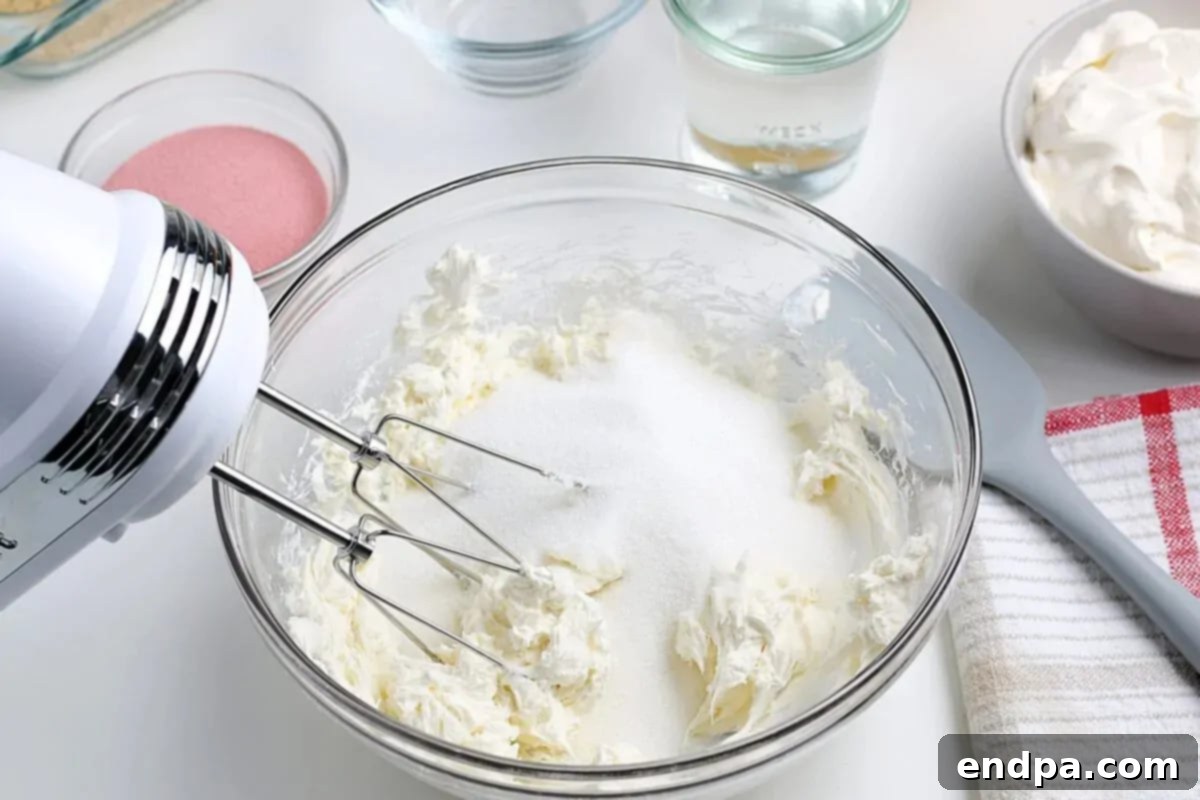 Cream cheese and sugar combined together with a mixer. 