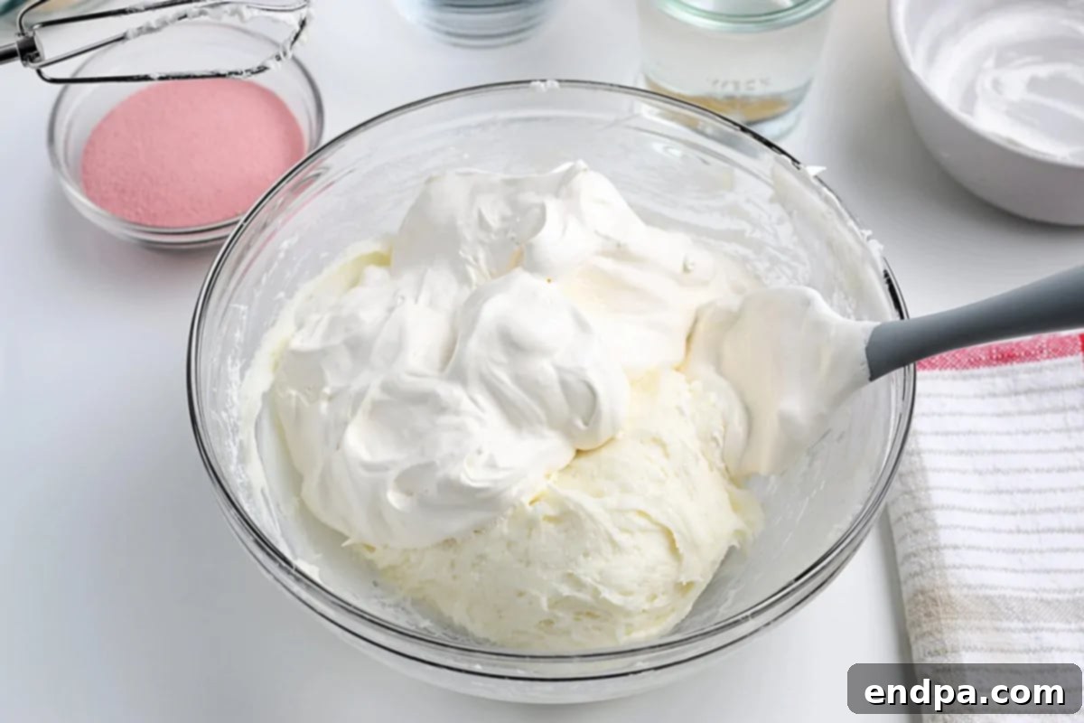 Whipped cream folded into mixture. 