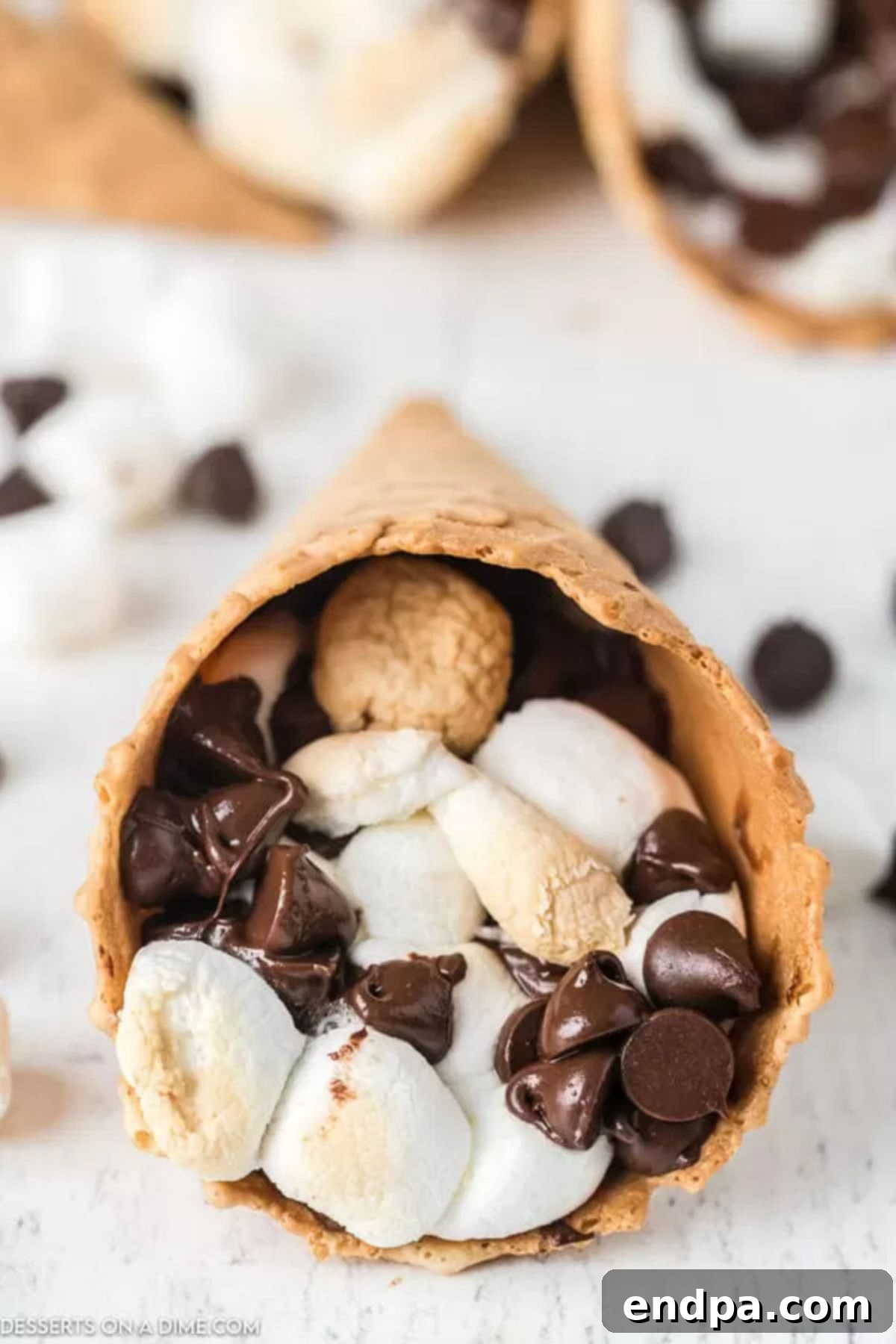 Smores cones filled with chocolate chips and marshmallows