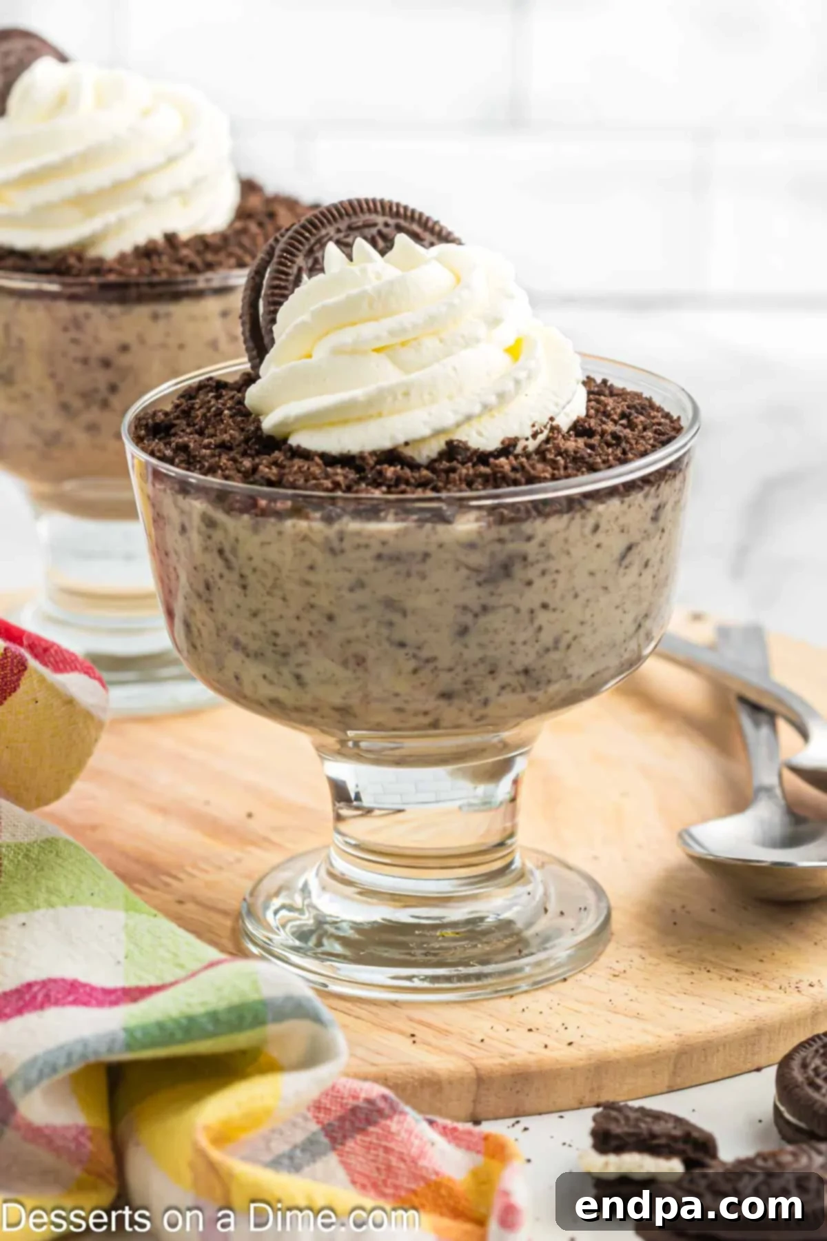 Two cups of finished Oreo pudding, ready to be enjoyed.