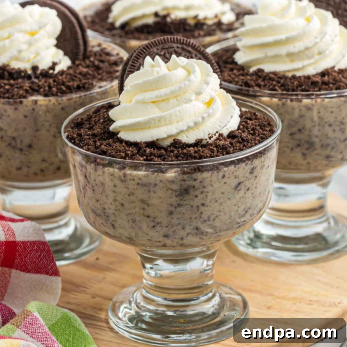 Homemade Oreo Pudding in a cup, ready to be served.
