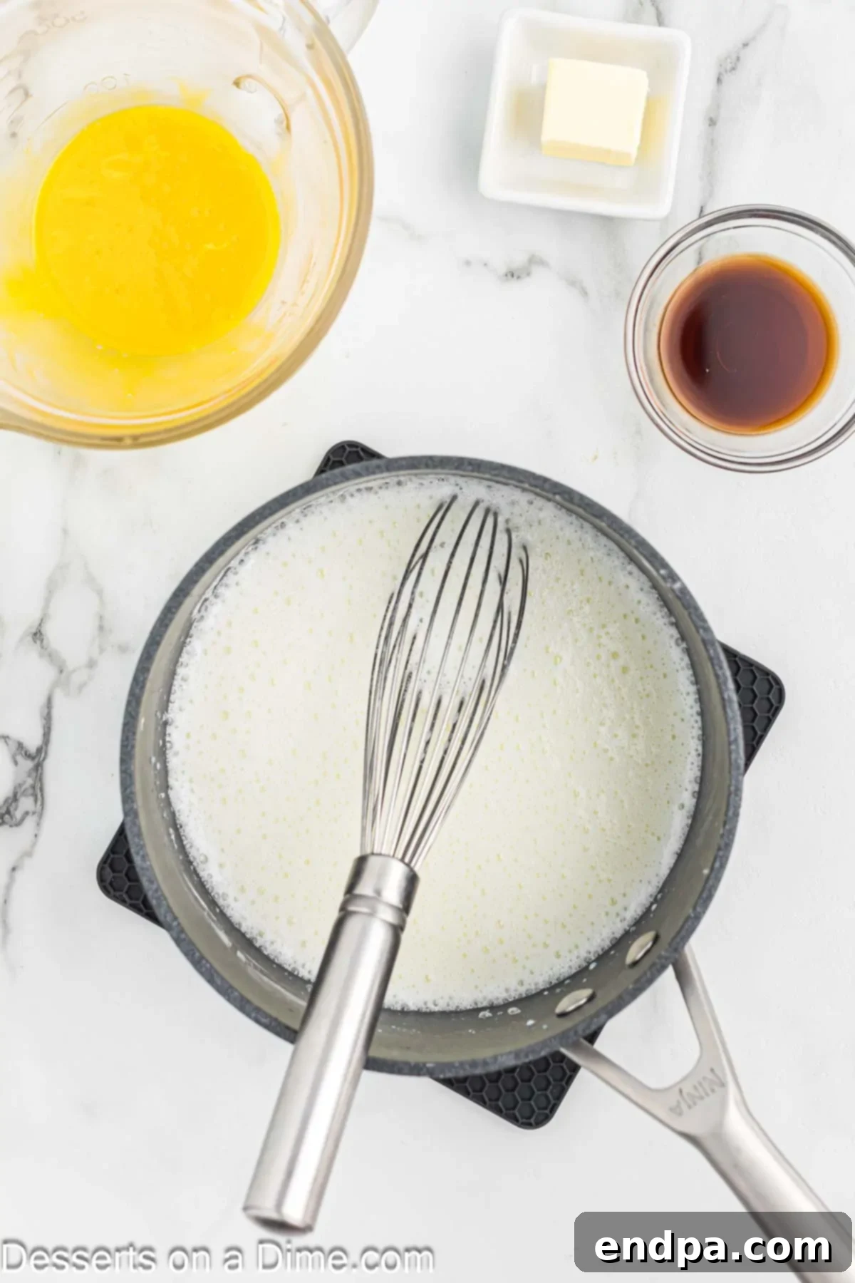 Whole milk being added to the saucepan with dry ingredients.