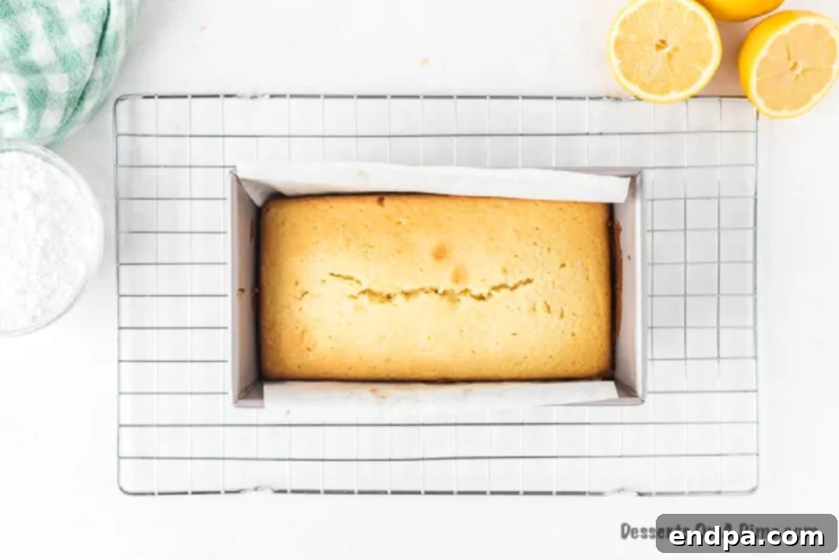 Ingredients for the lemon glaze combined in a bowl, being whisked.