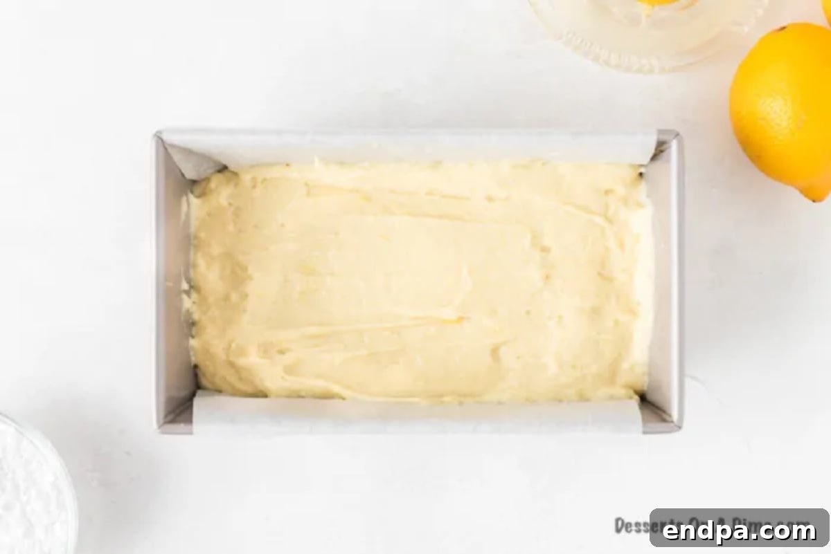 Baked lemon pound cake cooling on a wire rack.