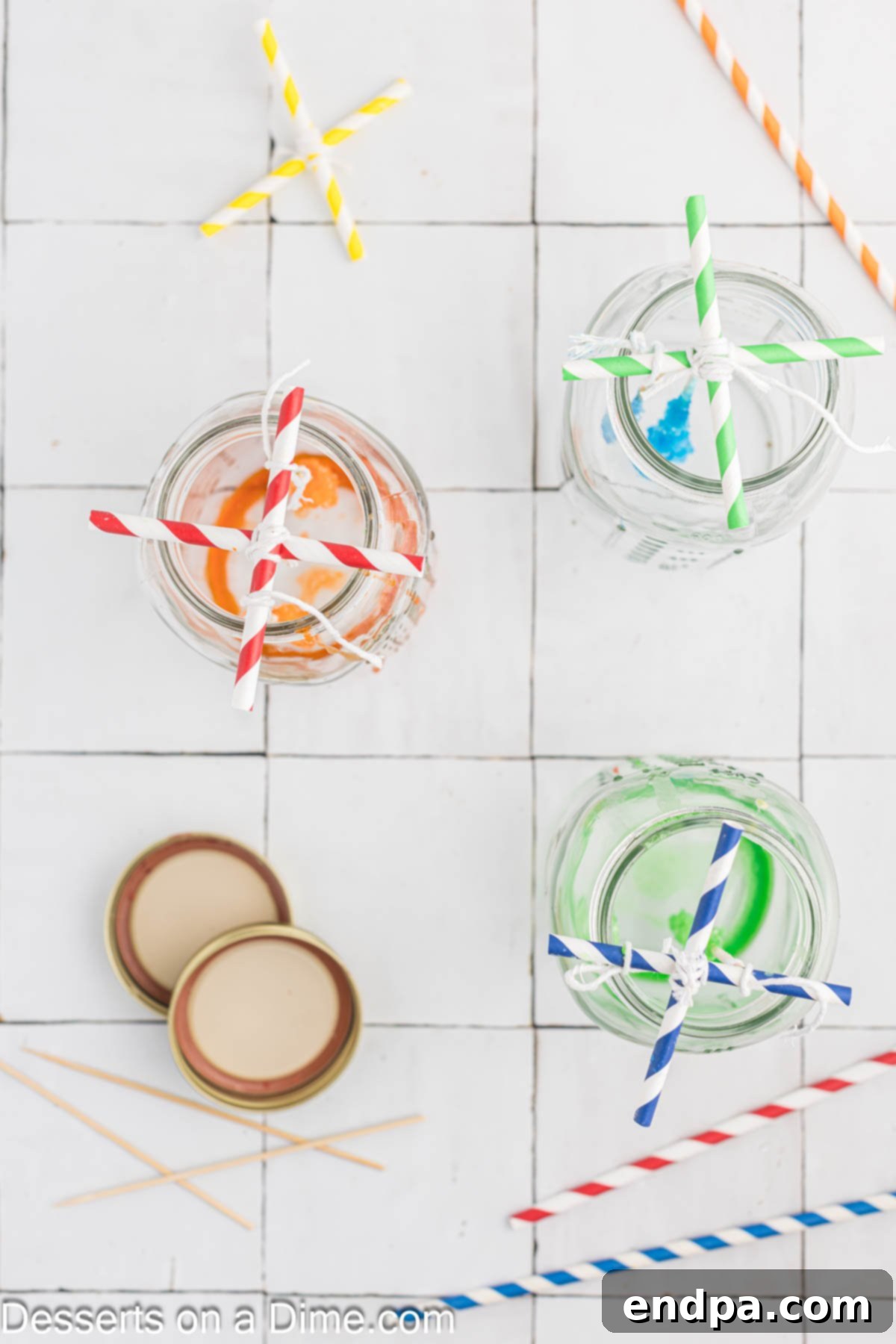 Growing Sweet Rock Candy Crystals 11 Rock candy sticks suspended from an 'X' shaped straw drying rack balanced on a jar.