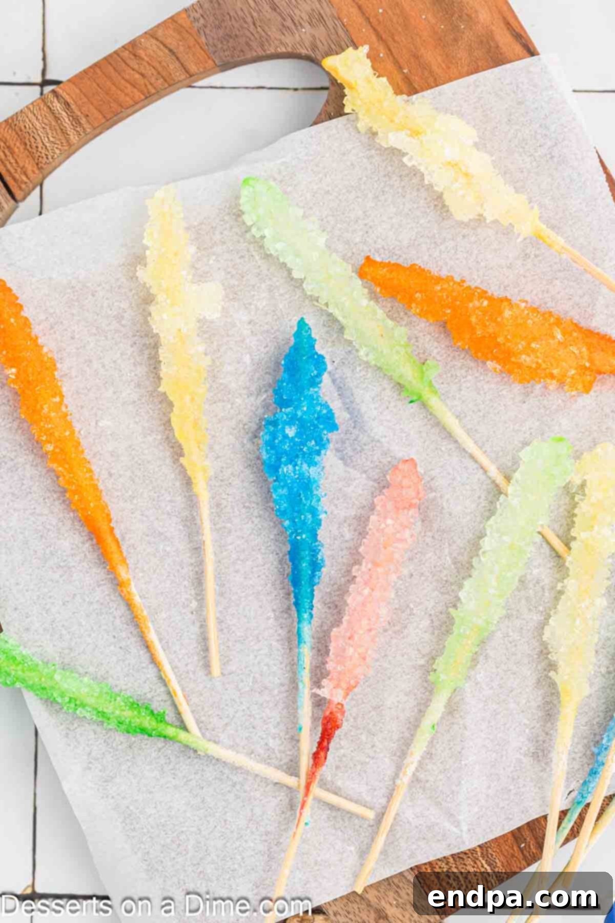 Growing Sweet Rock Candy Crystals 14 Finished rock candy sticks arranged on wax paper, sparkling and ready to eat.