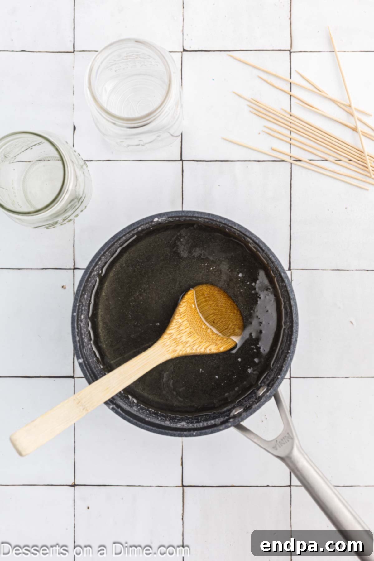 Growing Sweet Rock Candy Crystals 5 Close-up of clear sugar syrup in a pan after boiling, indicating dissolved sugar.